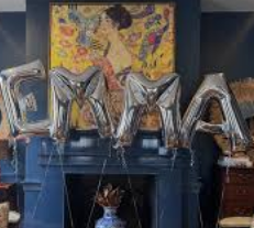 Bachelorette Airbnb decorated with balloons and a mimosa bar by Bienvenue Charleston