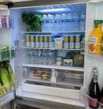 Stocked fridge and charcuterie board at a Charleston rental