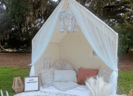Holy City Picnic tablescape with candles, glassware and charcuterie