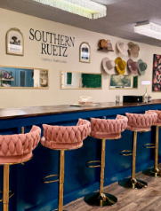 Bachelorette group in custom hats at Southern Ruetz hat bar in Charleston