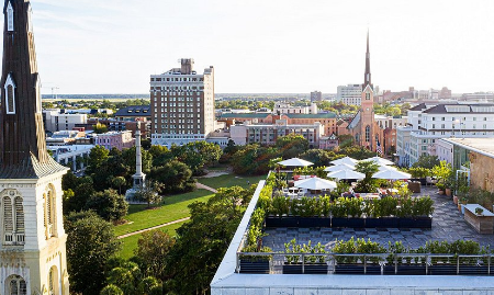 Rooftop bar overlooking downtown Charleston at night